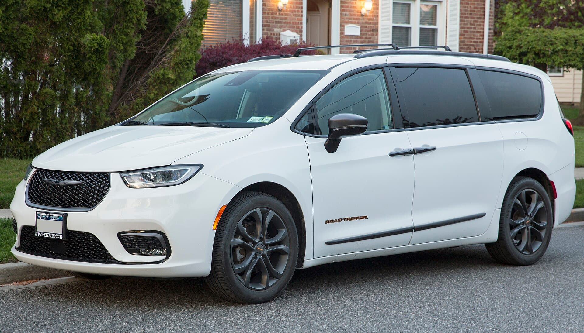 2024 Chrysler Pacifica — 2024 Chrysler Pacifica Touring L with the RoadTripper package (27L); Bright White with Black interior. MSRP of $51,695
