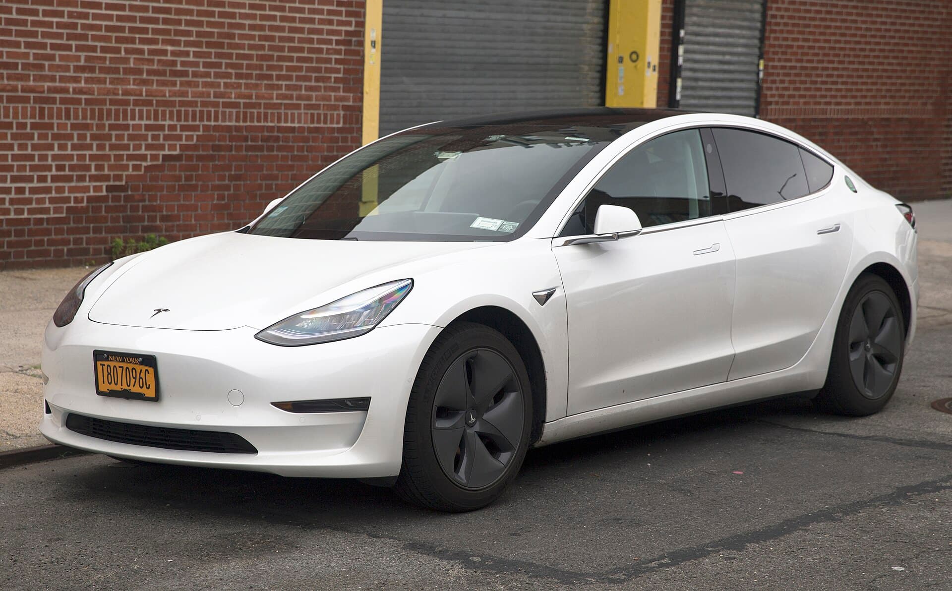 2024 Tesla Model 3 — A 2020 Tesla Model 3, with NYC T&amp;LC (Taxi and Limousine Commission) license plates. I presume it's some sort of ride sharing car, Uber o